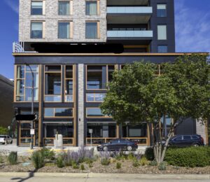 Second floor restaurant balcony framing with partial window openings and mullions, engineered to support future enclosure and exterior wind loads.