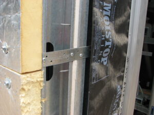 Cold-formed steel (CFS) framing uses zinc or zinc-aluminum galvanized coatings to create a protective barrier against moisture and corrosion.