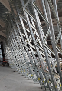 Lochsa Engineering designed complex cold-formed steel (CFS) hyperbolic wall trusses that curve in multiple directions. Engineers used finite element analysis to develop framing connections that accommodate seismic loads and building movement.