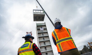 Part of the 10-story building is made from modular cold-formed steel framed units. Here the last unit is installed on top of the building. Photo: David Baillot/UC San Diego Jacobs School of Engineering