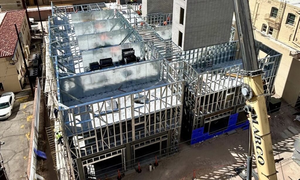 Industrialized Construction Solutions used cold-formed steel (CFS) to build a 7-story structure without a concrete podium. Vertically aligned bearing walls removed the need for concrete and red-iron transfers.