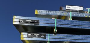 Cold-formed steel (CFS) product labeling communicates industry certification, web depth, flange size, member type and thickness, which allows teams to order the correct framing components. Photo credit: Marco Johnson