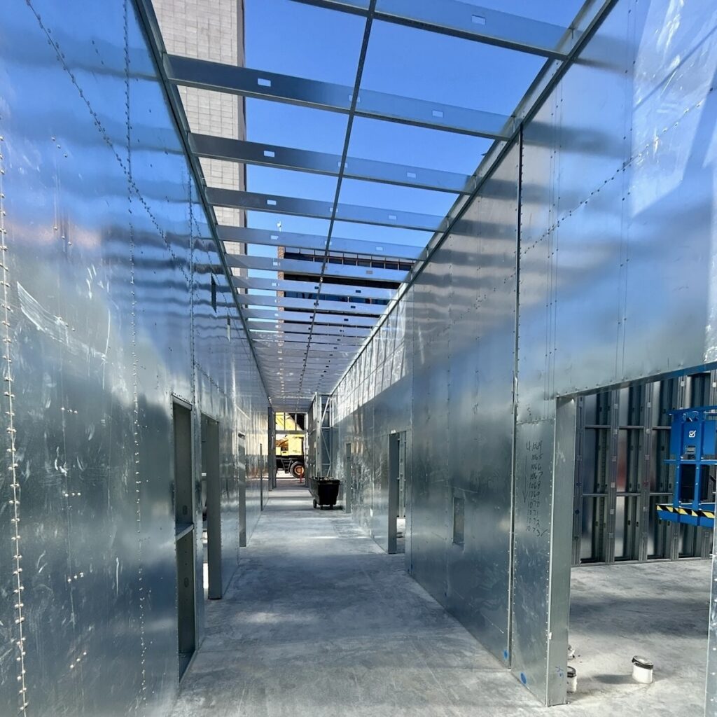 Sheet steel shear walls created straight, true walls and simplified drywall installation.