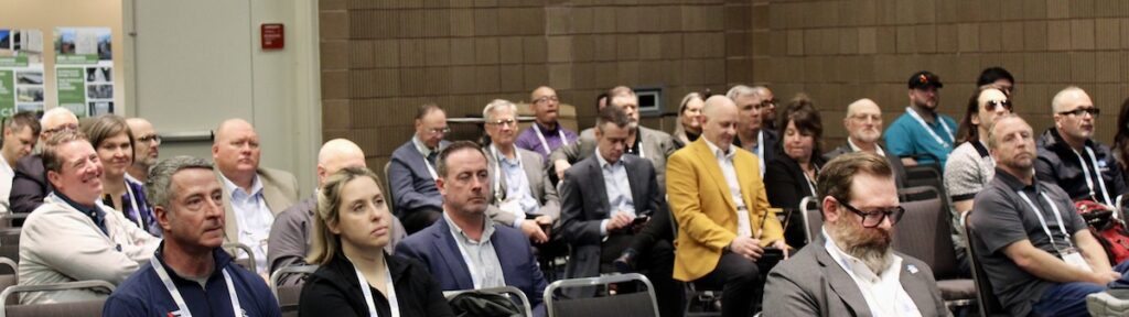 Attendees of the 2026 Steel Framing Industry Association (SFIA) SFIA General Session held in conjunction with BUILD26 in New Orleans watch the 2025 SFIA Awards presentation.