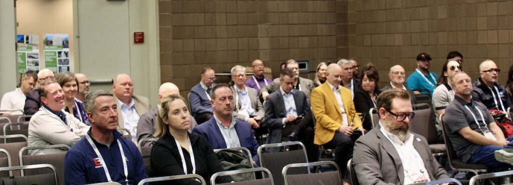Attendees of the 2026 Steel Framing Industry Association (SFIA) SFIA General Session held in conjunction with BUILD26 in New Orleans watch the 2025 SFIA Awards presentation.
