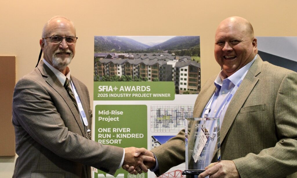 Steel Framing Industry Association (SFIA) Technical Director Pat Ford (left) presents the SFIA 2025 Mid-Rise Project Award to Karl Klostermann of Engineered Steel Products, a division of Negwer Materials, during the 2026 SFIA General Session in New Orleans.