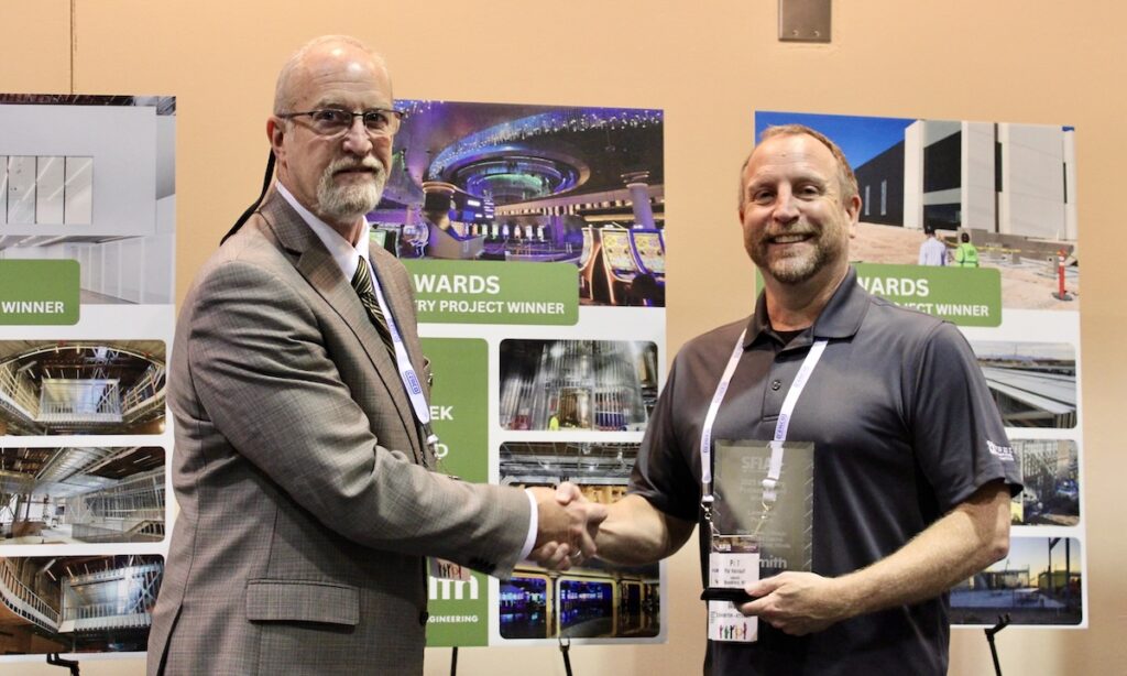 At right, Pat Hainault of raSmith accepts the 2025 Steel Framing Industry Association (SFIA) 2025 Low-Rise Project Award from SFIA Technical Director Pat Ford during the 2026 SFIA General Session in New Orleans.