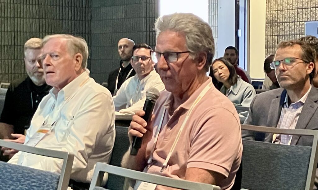 Mark V. Holland, P.E., chief engineer at Paxton & Vierling Steel Co., Omaha, Neb., raises a point on cold-formed steel (CFS) standards during a Steel Conference session. Holland serves on the American Institute of Steel Construction Committee on Specifications and chairs the AISC Manual Committee.