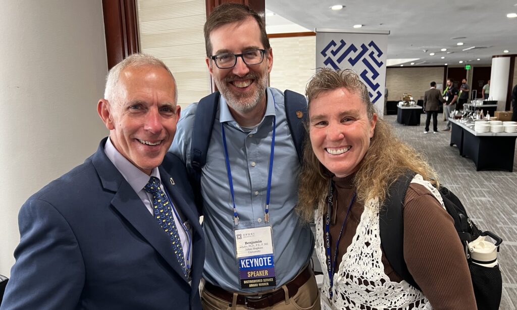 Don Allen, executive director of the Steel Framing Industry Association (SFIA); Benjamin Schafer, Ph.D., of Johns Hopkins University; and Tara Hutchinson, Ph.D., of the University of California San Diego pause during a break at the 2026 CFSEI Expo in Long Beach, California.