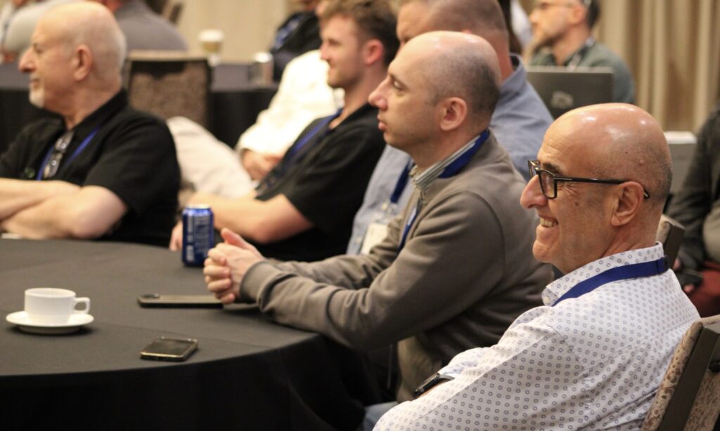 Nicola Ishaq of Bailey Metal Products enjoys a presentation during the 2026 CFSEI Expo in Long Beach, California. Attendees packed technical sessions throughout the record-setting conference.