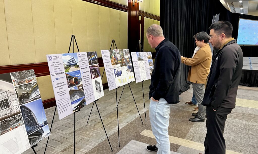 Attendees at the 2026 CFSEI Expo in Long Beach review photo displays featuring the conference’s winning Design Excellence and Creative Detail Award projects.