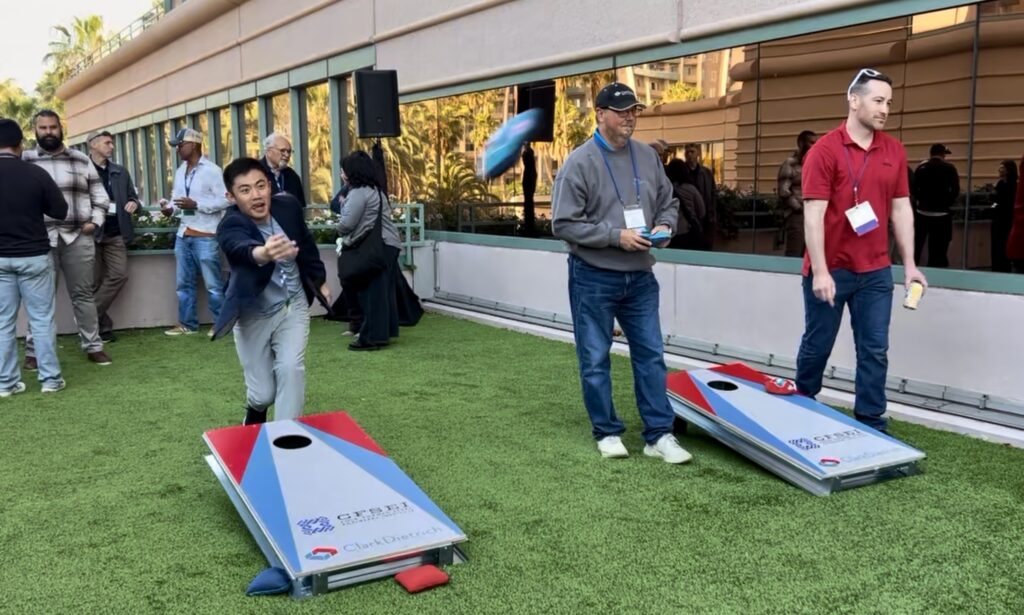 CFSEI Expo attendees compete in cornhole during the Monday evening welcome reception at The Westin Long Beach in Long Beach, California.