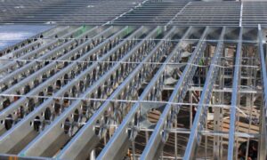 Floor systems play a critical role in the load path, acting as diaphragms that transfer lateral forces to vertical elements, with proper design and connections driving performance.