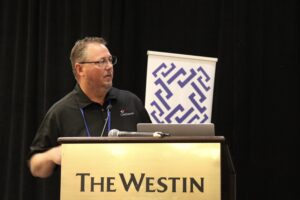 Lynn Padgett of ClarkDietrich Engineering Services explains the design of the 10-story CFS10 test building during the CFSEI Expo keynote. Photo: Marco Johnson