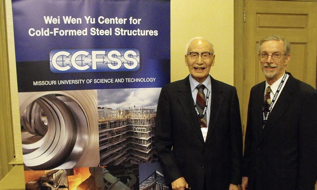 Dr. Wei-Wen Yu, center, stands with longtime colleague Dr. Roger LaBoube at Missouri University of Science and Technology.