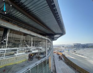 The exterior soffits followed long, radius-driven curves while changing pitch and angle around the building perimeter. Coordinated digital modeling defined the framing geometry before construction, reducing field adjustments and maintaining continuity.