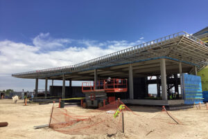 The stepped roof required CFS framing that could support tall clerestory walls while maintaining the aircraft-inspired architectural profile.