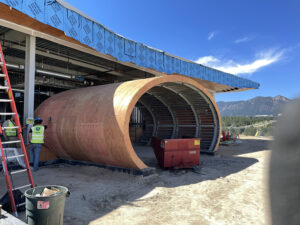 Radius Track framing formed the curved soffits that help give the visitor center its aircraft-inspired appearance.