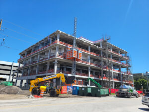 Construction progressed before installation of the prefabricated cold-formed steel curtain wall system. Completing the building enclosure quickly reduced weather exposure on the coastal Florida project.