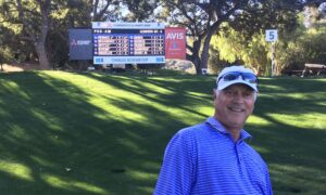 Tom Porter poses beside a pro-am leaderboard during one of his favorite pastimes. Porter plans to retire Dec. 31 after leading CEMCO through nearly four decades of growth and industry service.