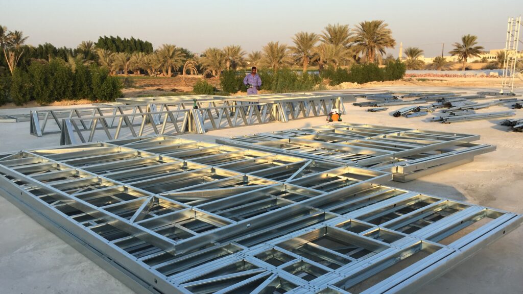 Prefabricated cold-formed steel framing components await installation at a construction site. FRAMECAD’s new Steelform Core produces wall frames, floor joists and trusses.