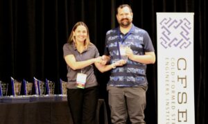 Derek Putz, P.E., American Way Engineering Accepts the CFSEI Design Excellence First Place Award, Commercial Category Presented by Tammy Gleed, P.E., CFSEI Immediate Past Chair