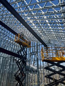 Cold-formed steel (CFS) framing provided the precision and flexibility needed to accommodate complex ceiling geometries and structural steel connections.