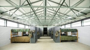 Cold-formed steel (CFS) roof trusses span a U.S. Army barracks at Fort Bliss, Texas, where contractors fabricated them on site to reduce transportation needs and manufacturing delays.